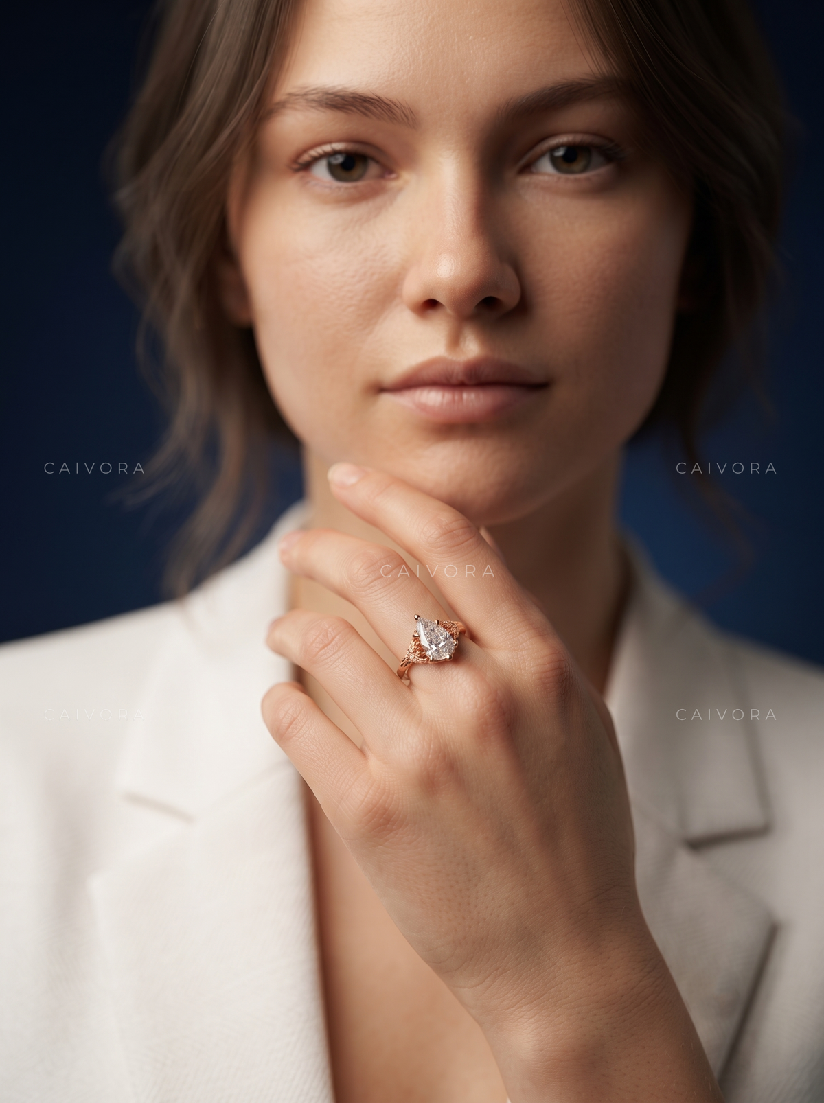 Roselle Contour Ring with a Pear-Shaped Diamond