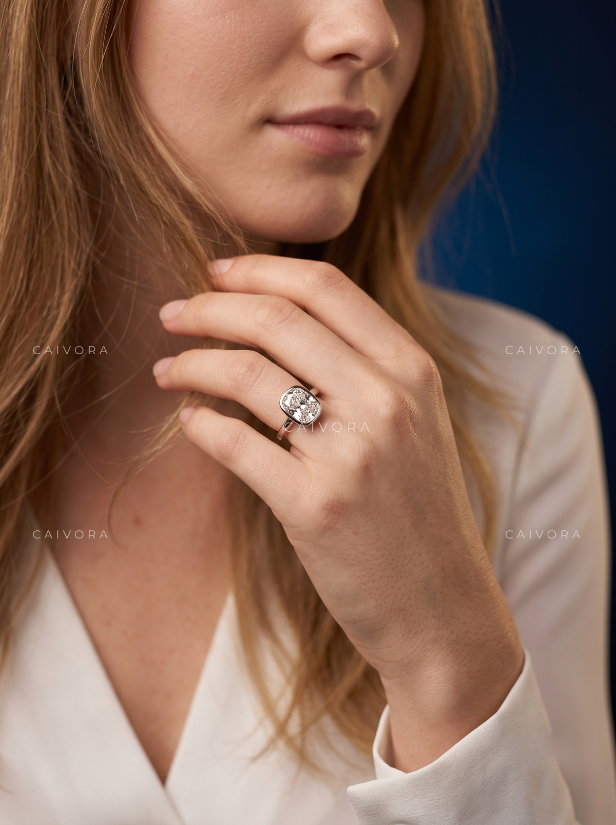 Sculpted Grace with an Elongated Cushion Cut Center