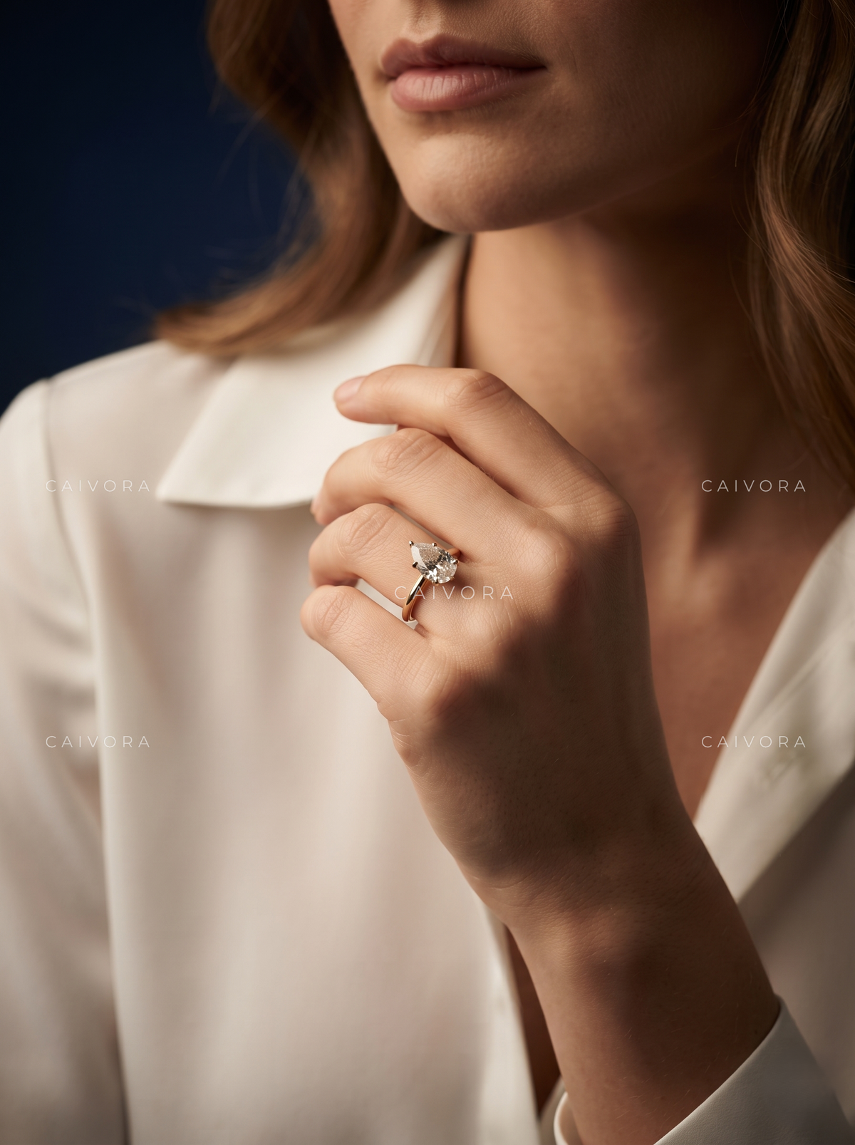 Refined Tapered Cathedral Setting with a Pear Cut Center Diamond