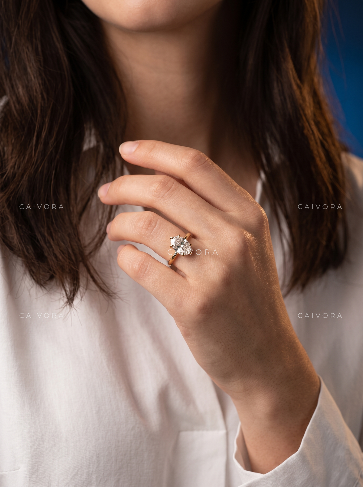 Timeless Tapered Cathedral Engagement Ring with an Oval Cut Diamond