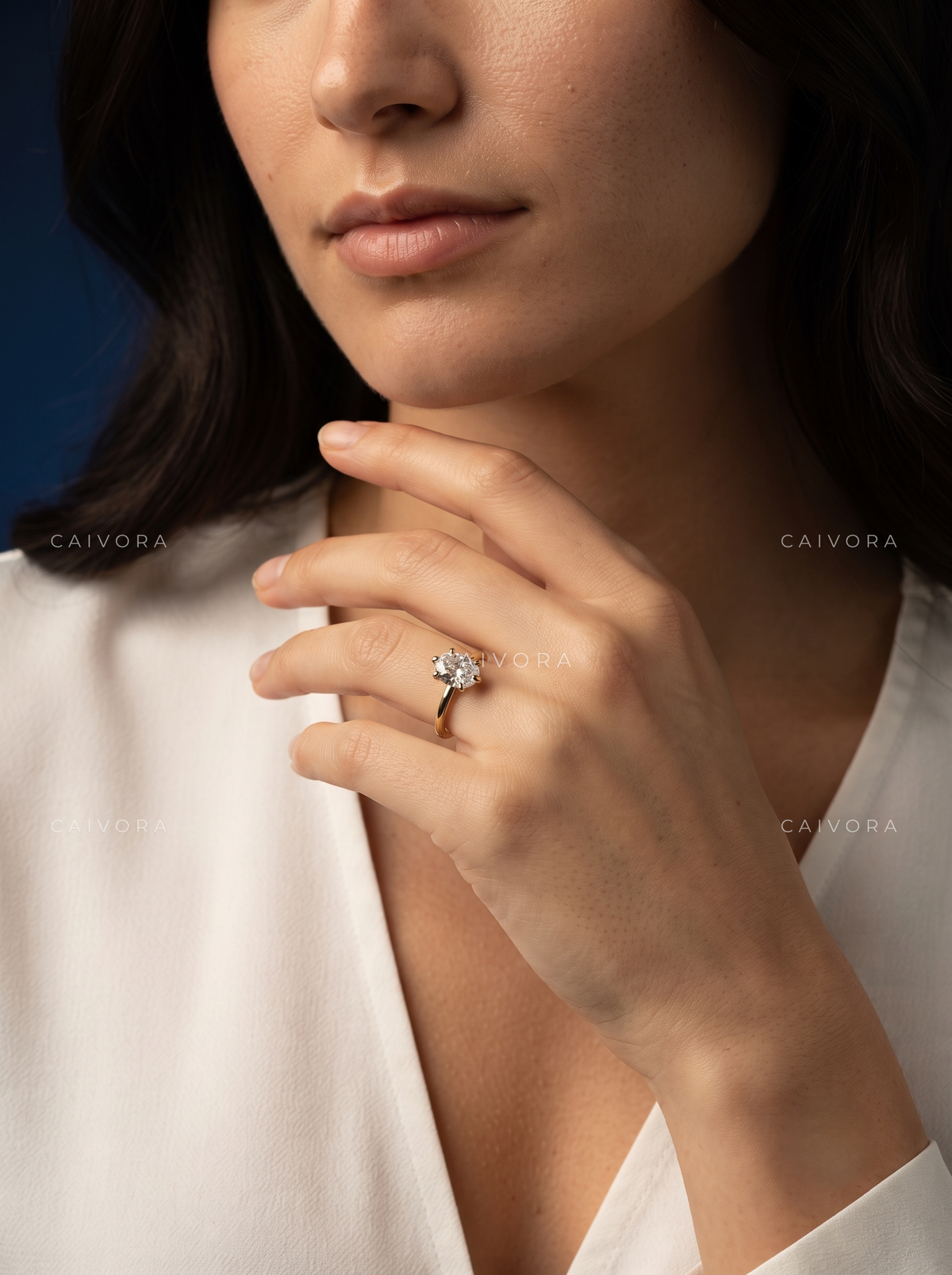 Classic Tapered Cathedral Engagement Ring Centered on a Round Cut Diamond