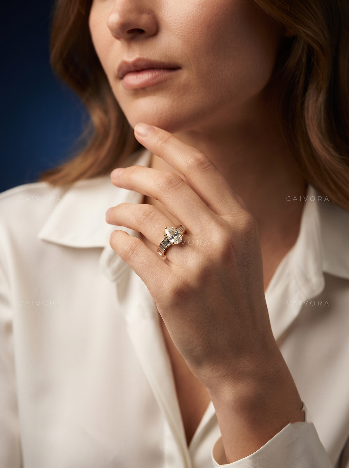 Pear Shaped Diamond Channel Setting Engagement Ring with Baguette Accents