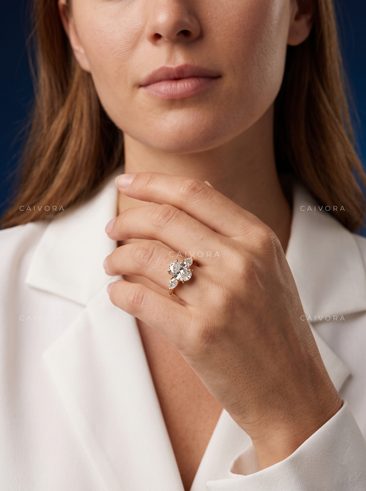 Sophisticated Three Stone Setting Highlighting an Oval Cut Center Diamond