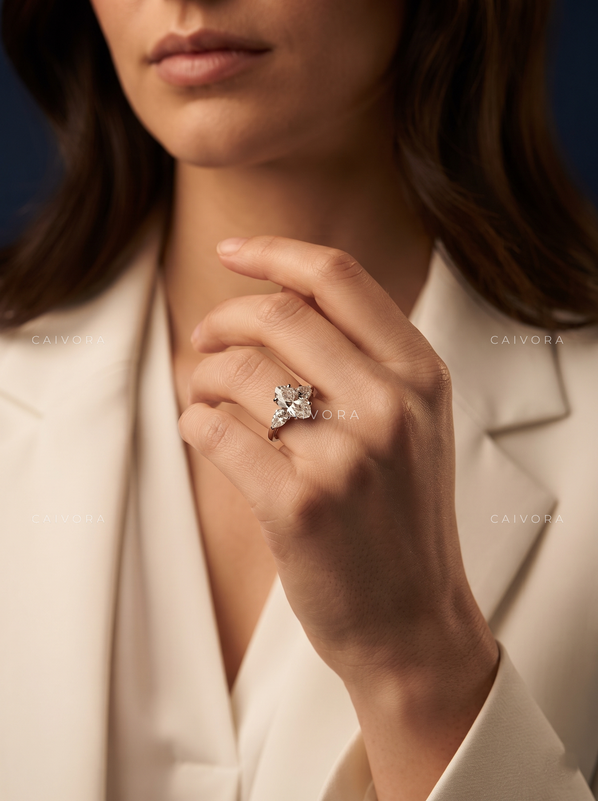 Graceful Three Stone Silhouette with an Moval Cut Center