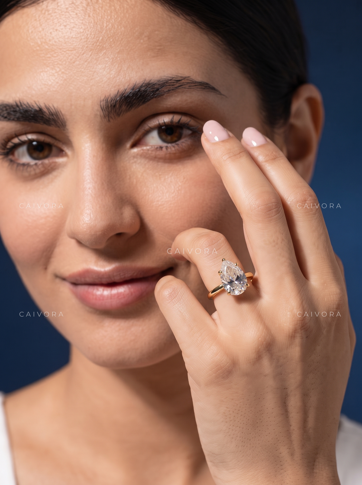 Refined Tapered Cathedral Setting with a Pear Cut Center Diamond