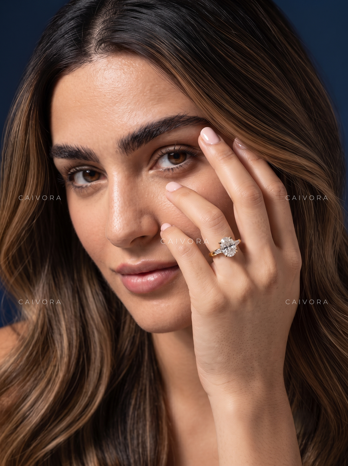 Elongated Brilliance in an Oval Cut Three Stone Setting