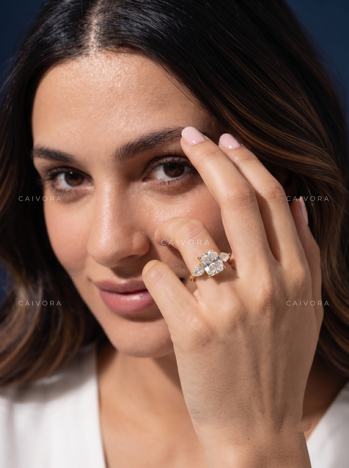 Romantic Three Stone Engagement Ring with a Cushion Cut Center