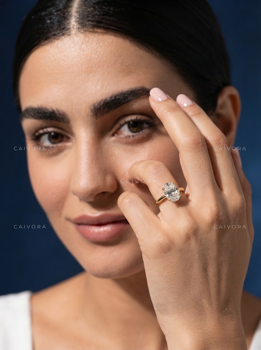 Timeless Tapered Cathedral Engagement Ring with an Oval Cut Diamond