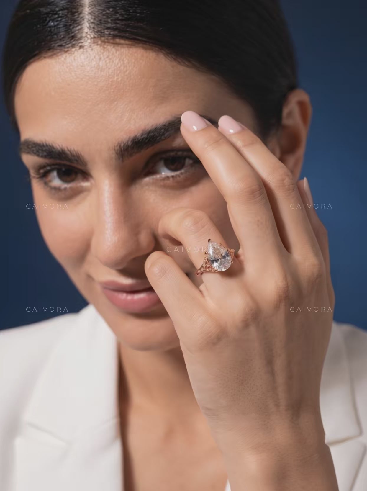 Roselle Contour Ring with a Pear-Shaped Diamond