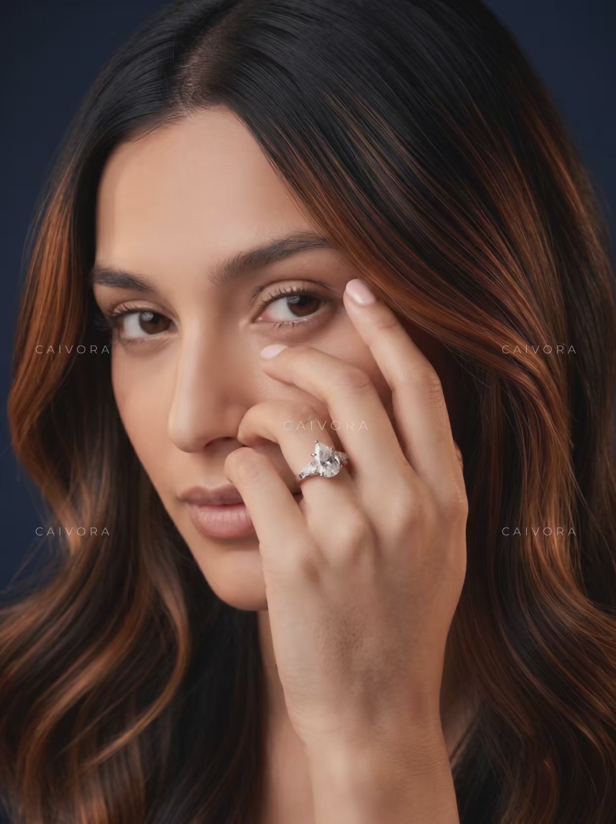 Graceful Contours with a Pear Cut Center Diamond