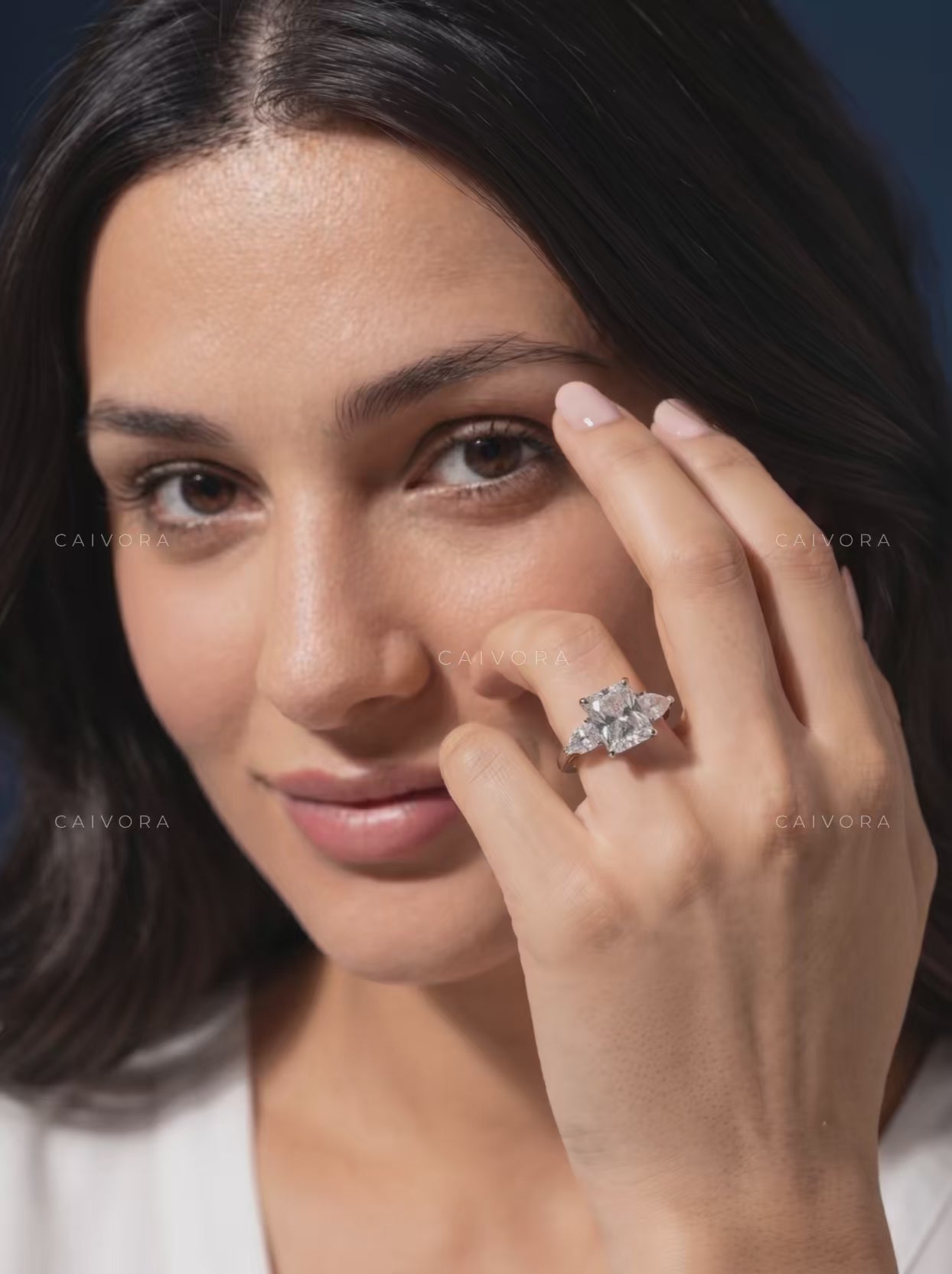 Refined Three Stone Setting Framed by a Radiant Cut Center Diamond