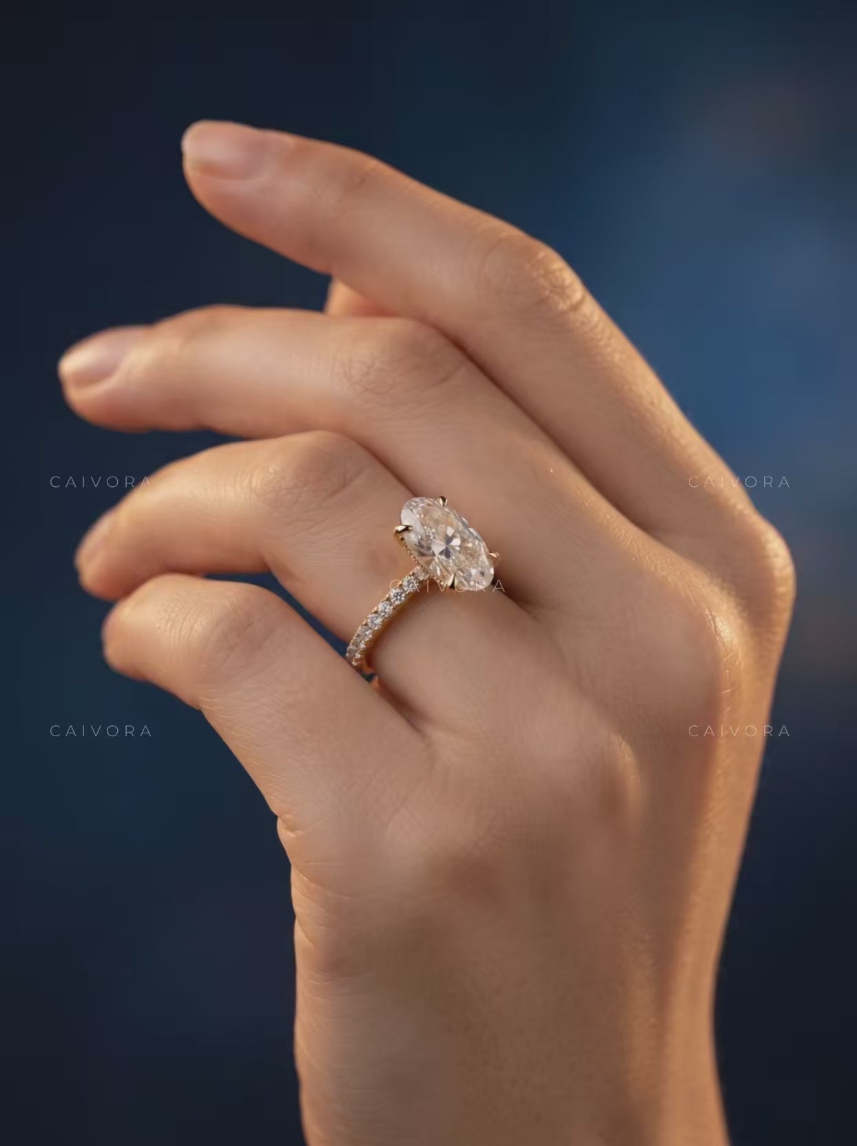 Moval Cut Diamond Engagement Ring with Brilliant Pave Accents